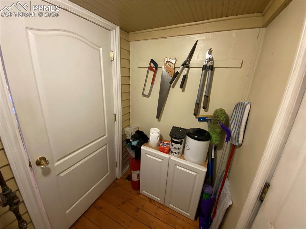 Enjoy hidden extra storage near the back door, adding practicality and organization to your backyard access and everyday living.