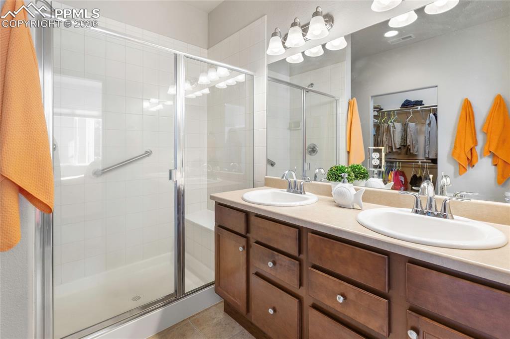 This is the primary bath with dual sinks and a huge shower!