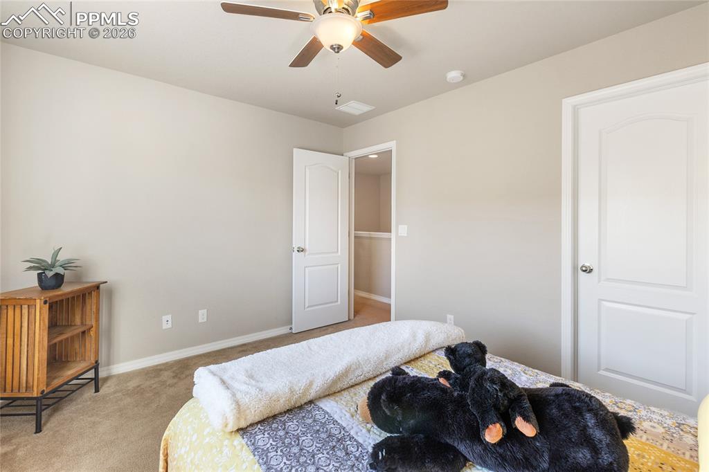 This upper level bedroom is well sized and has a nice big walk in closet!