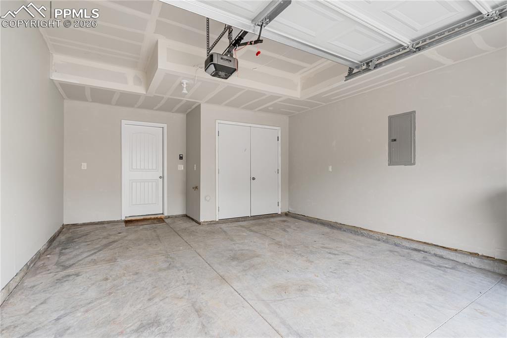 The attached garage is finished on the interior and houses the utility closet.  There is water available here to wash cars or more.