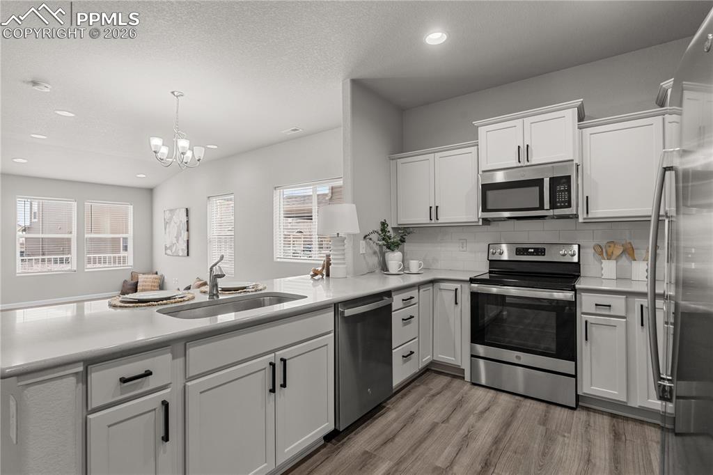 The kitchen is stunning with upgraded hardware and like new stainless appliances.