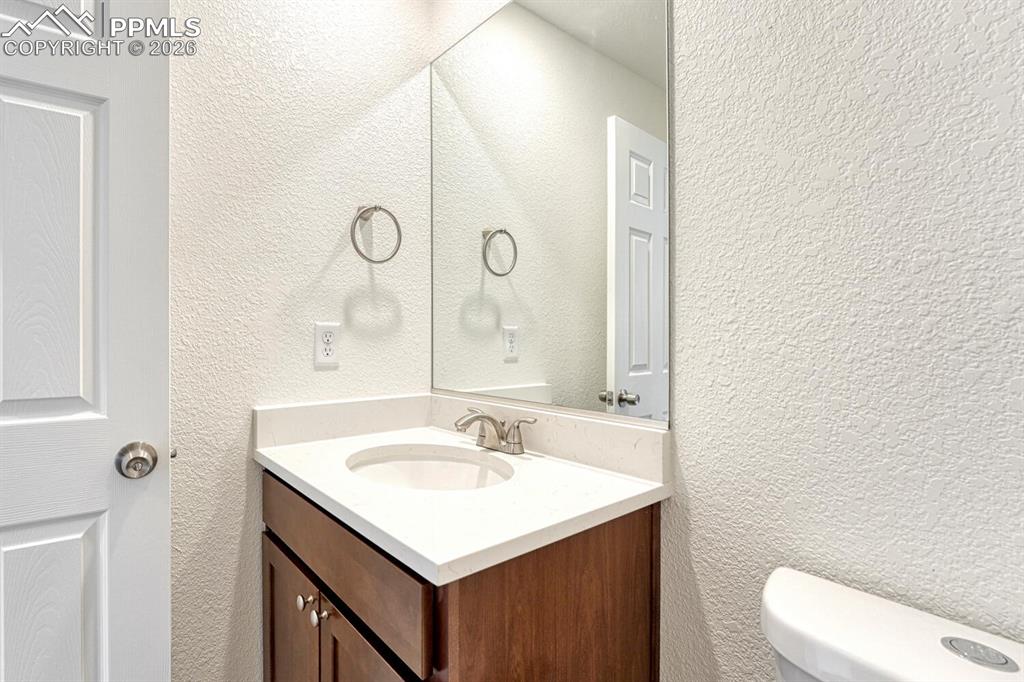Half bath with your choice of cabinetry and countertop is on the main level. Undermount sink is standard.