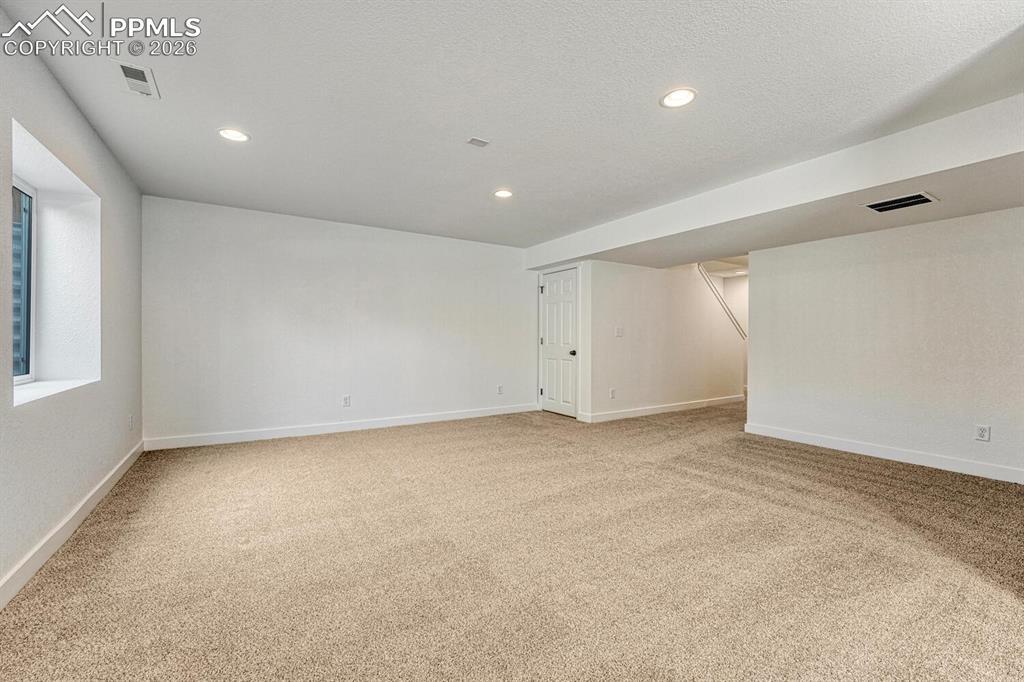 Generously sized rec room is pre-plumbed for a wet bar.