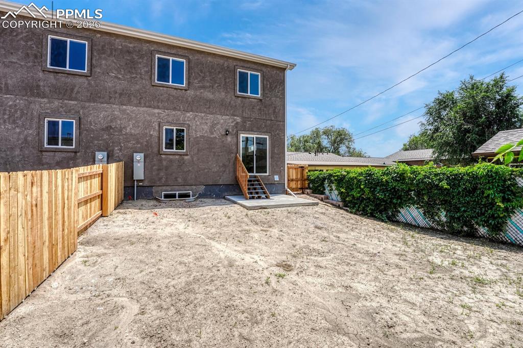 Sizable backyard is fully fenced for privacy and pets.