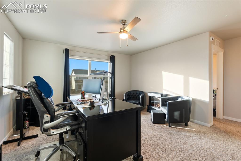 Upper-level loft, ideal for office or flex space.”