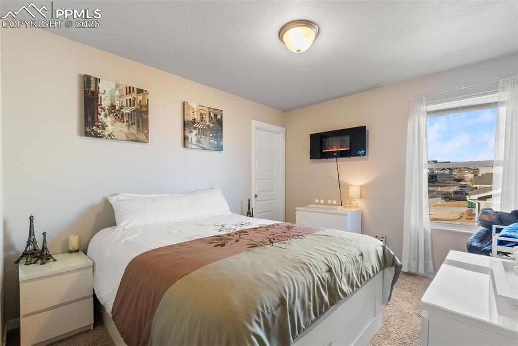Upper-level bedroom with natural light.