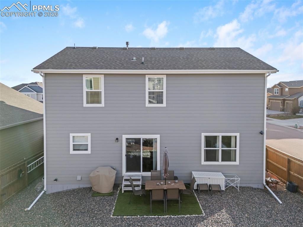 Back of home with walkout access.