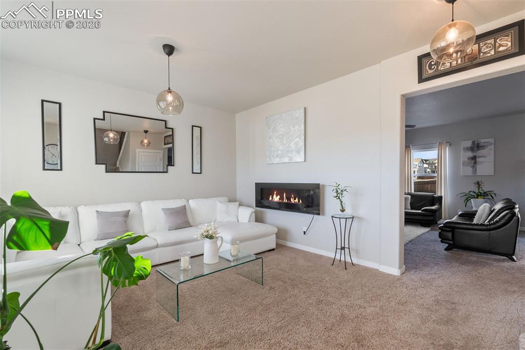 Bright sitting room with modern light fixtures. 