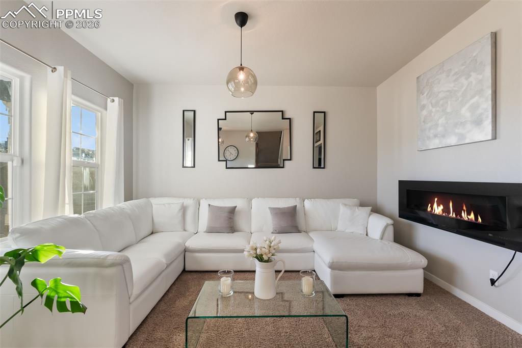 Inviting sitting room with natural light.