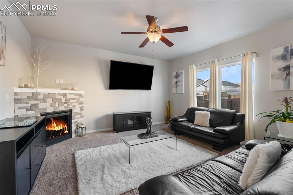 Spacious living room with updated brick built-in fireplace.