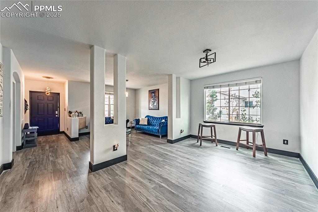 Living room featuring wood finished floors and a textured ceiling
