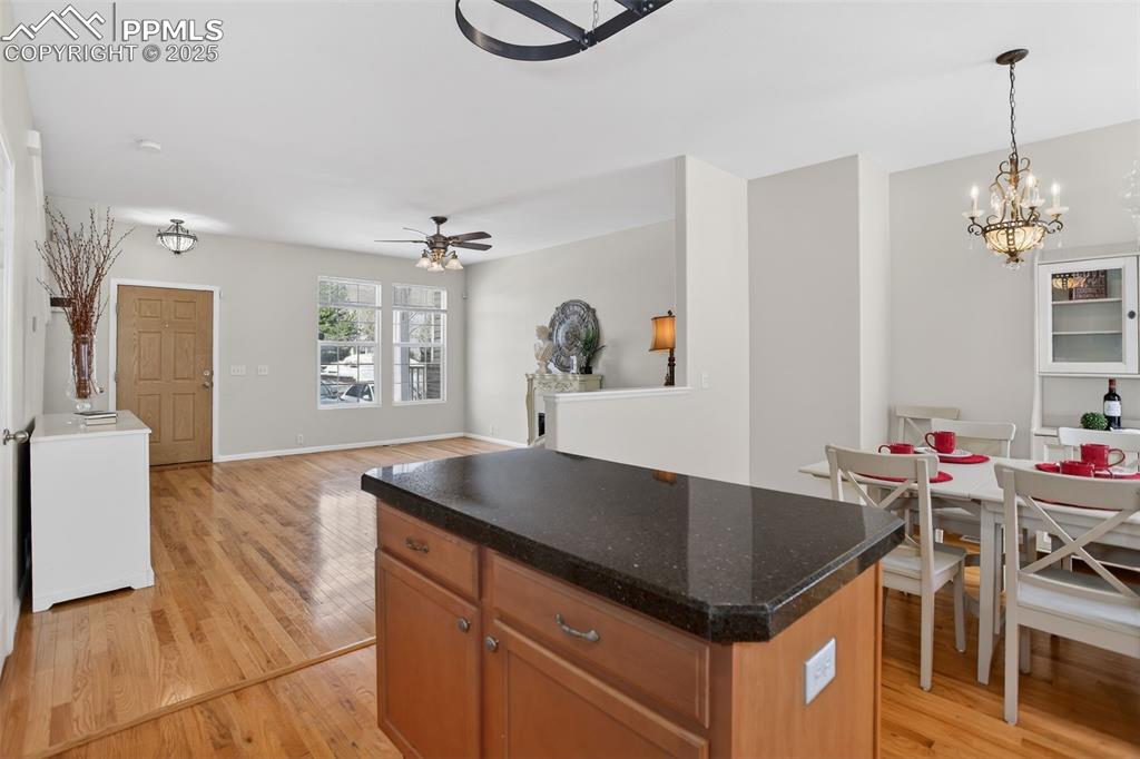 Mosaic tiled backsplash, Italian glass granite overlay countertops, pantry, ample cabinets, pot rack and center island!