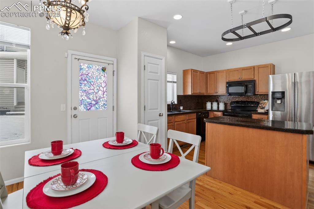 Dining space right off the kitchen with access to the back of the structure.