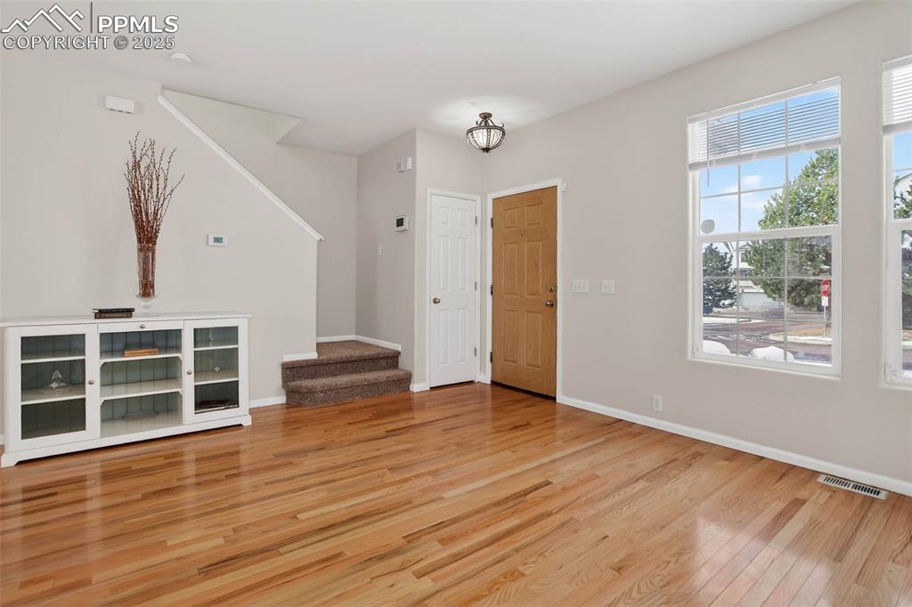 Spacious and bright living room with hardwood flooring!
