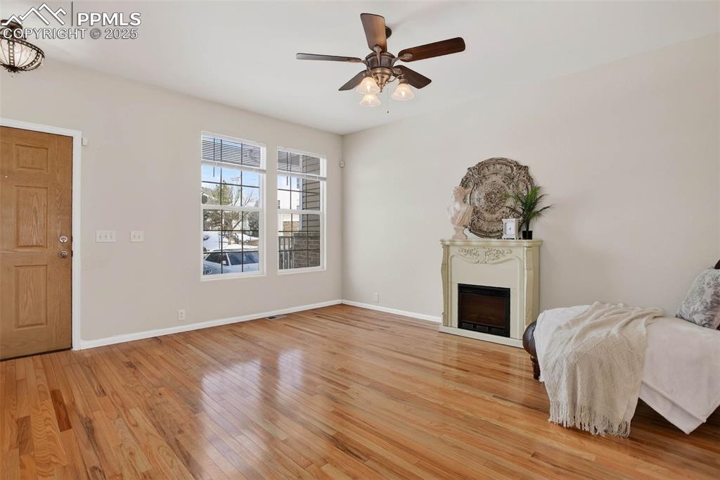 Spacious and bright living room with hardwood flooring!