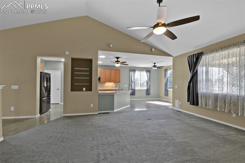 Living room with vaulted ceilig