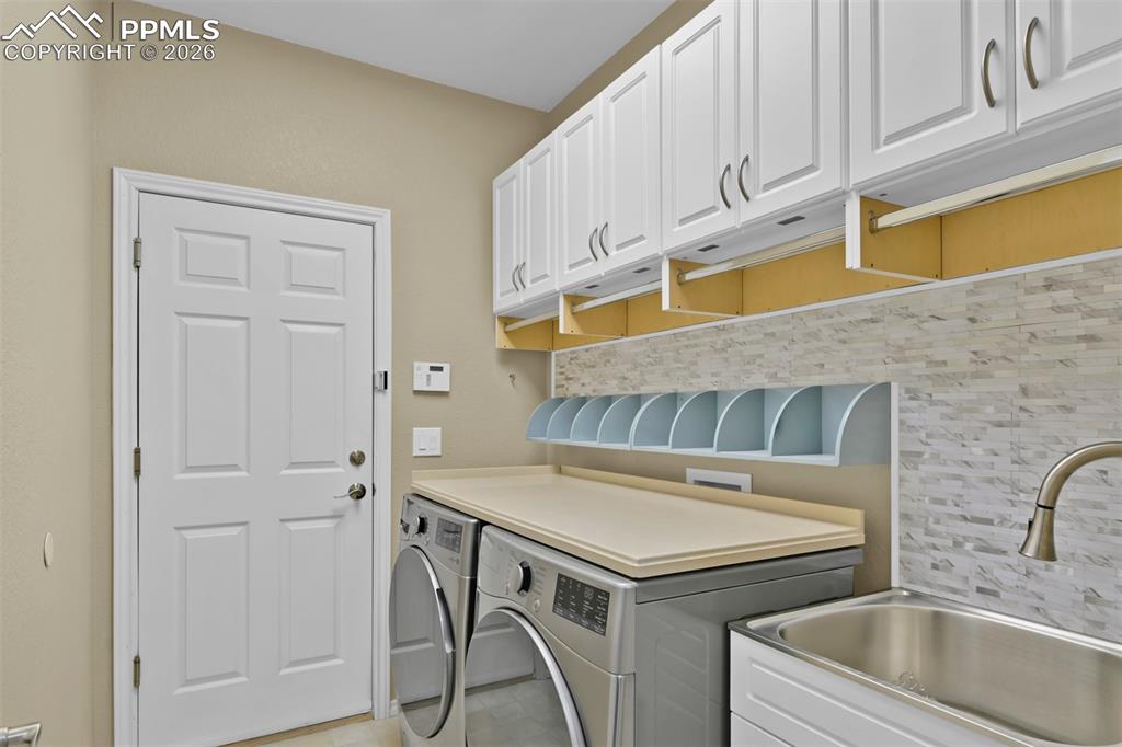 Laundry with mud sink and cabinets