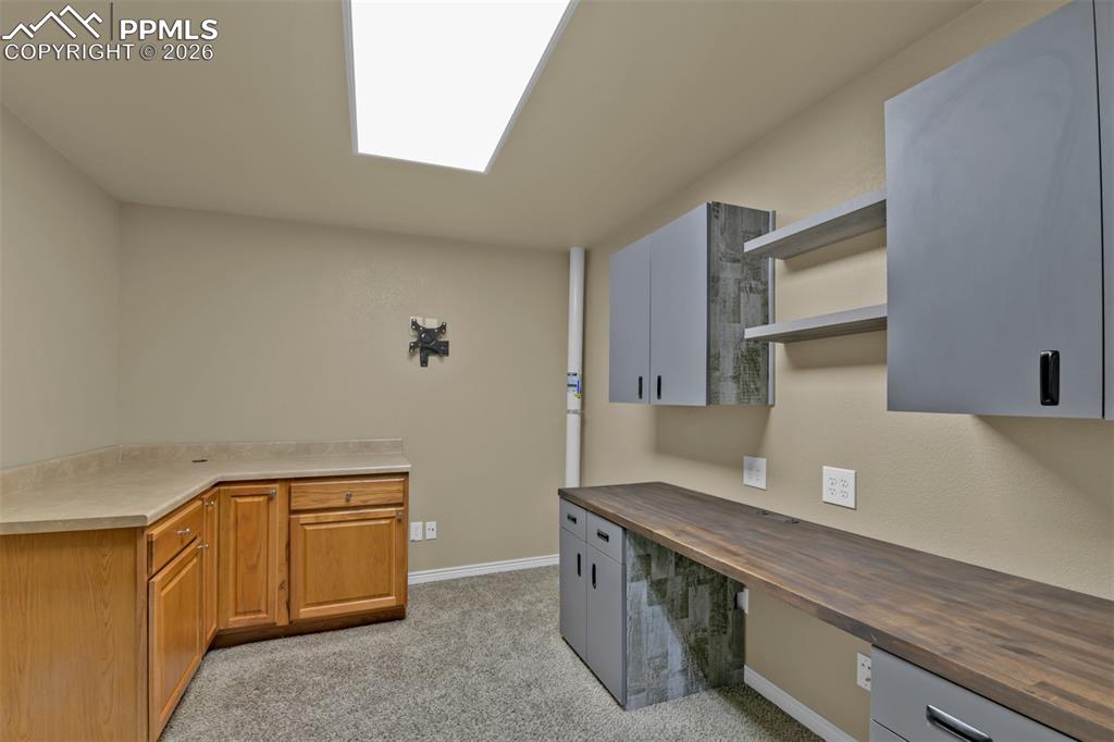 Basement office with cabinets