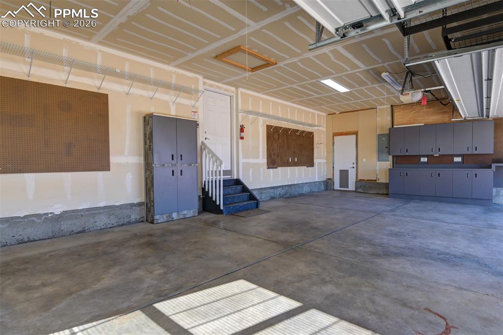3 car garage with cabinets 