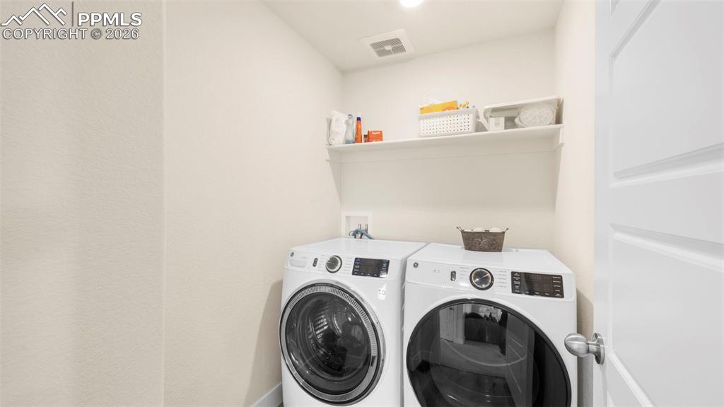 Laundry area featuring washing machine and dryer