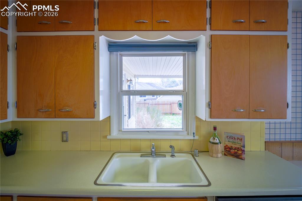 Kitchen sink looks out to the back patio and offers great natural light