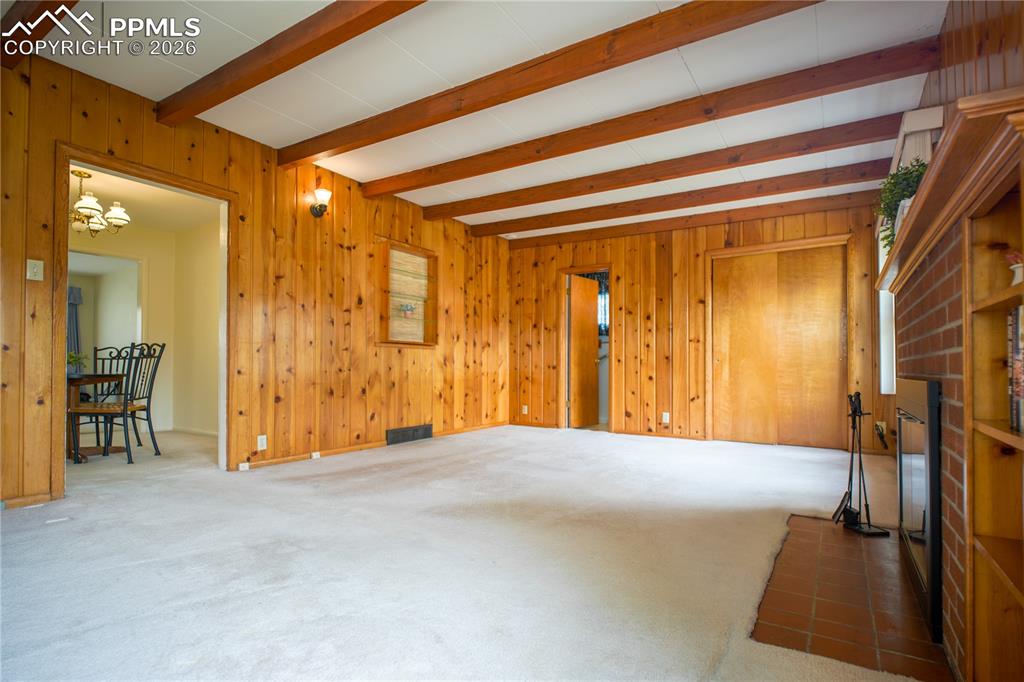 Lots of potential for a 3rd bedroom with walk-in closet, or an in-home office with hidden storage, or warm family room with storage for games, etc - the possibilities are endless. 