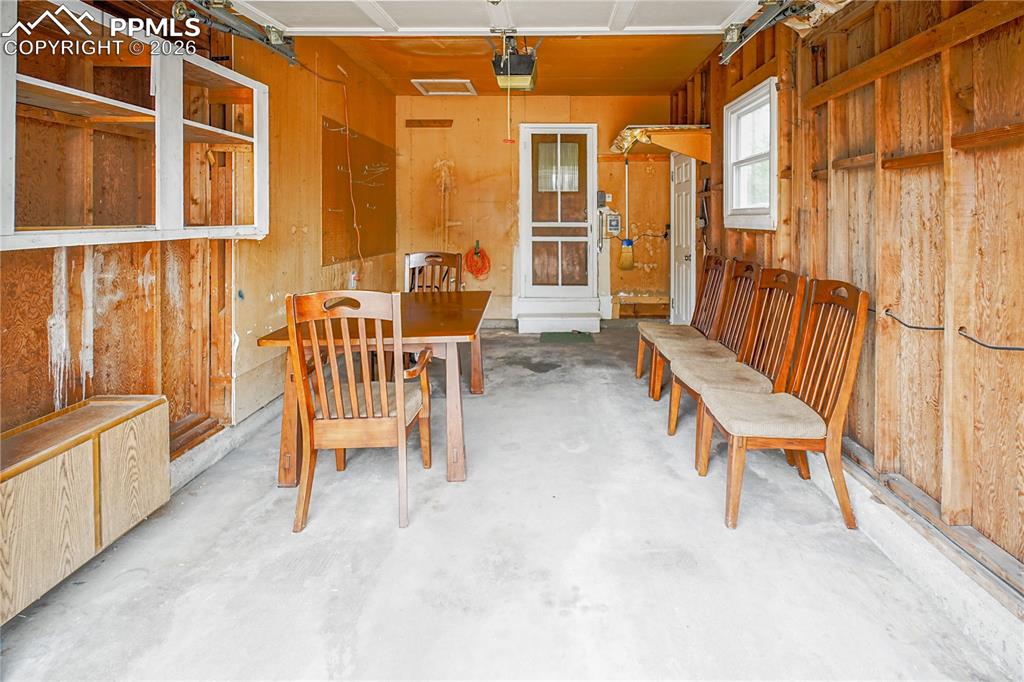 A single car garage with screened door to the main house and access door to the side and backyards