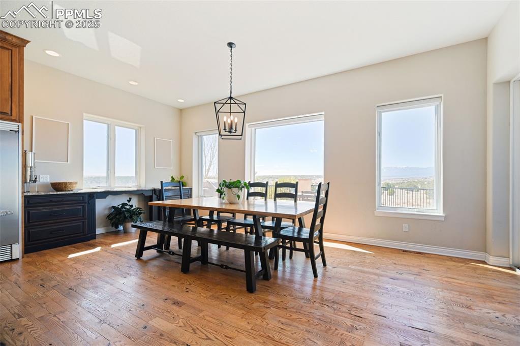 A separate dining area is just off the kitchen with an expanded buffet area along the wall.