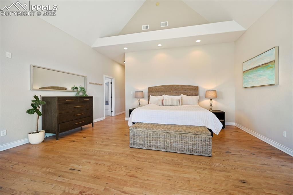 The master bedroom retreat is on the south side of the main level, with its own entrance to the sprawling composite deck.