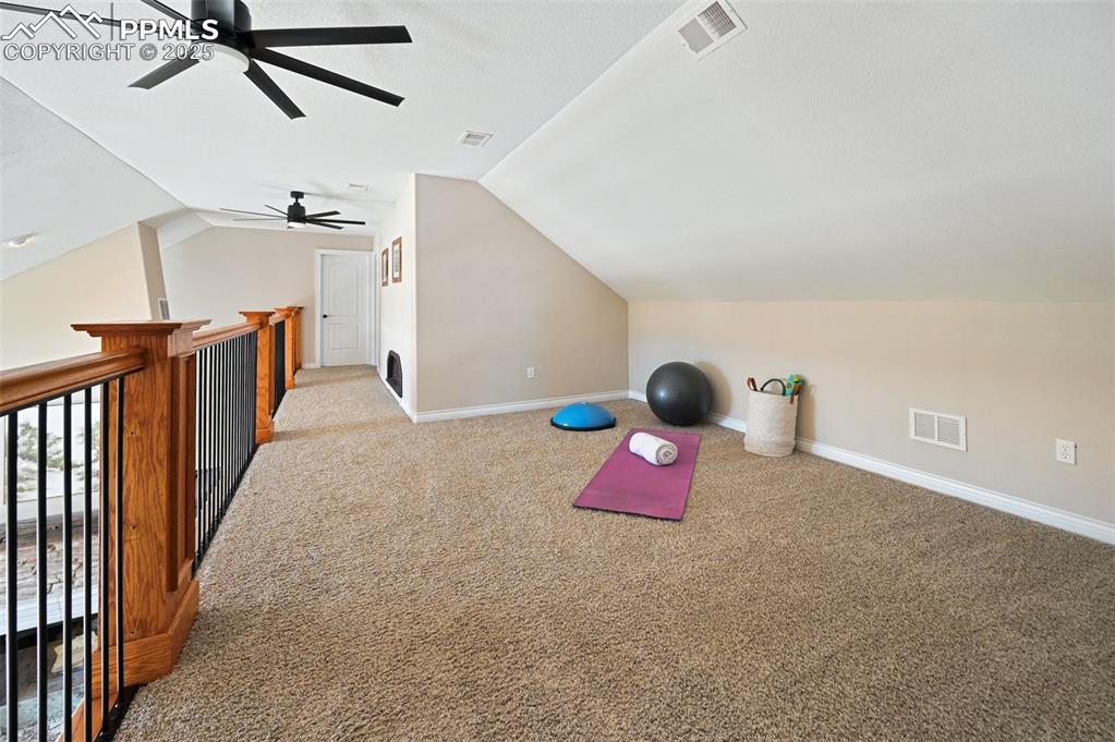 Upstairs you will find a spacious loft that looks down at the living room.
