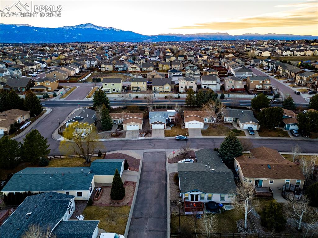Aerial view at dusk of a residential view and a mountain view
