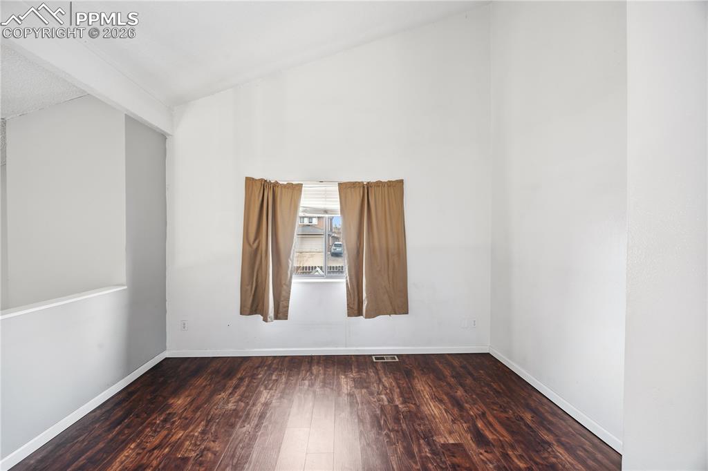 The upper level versatile loft offers flexible use as a den, home office, or additional living space. 