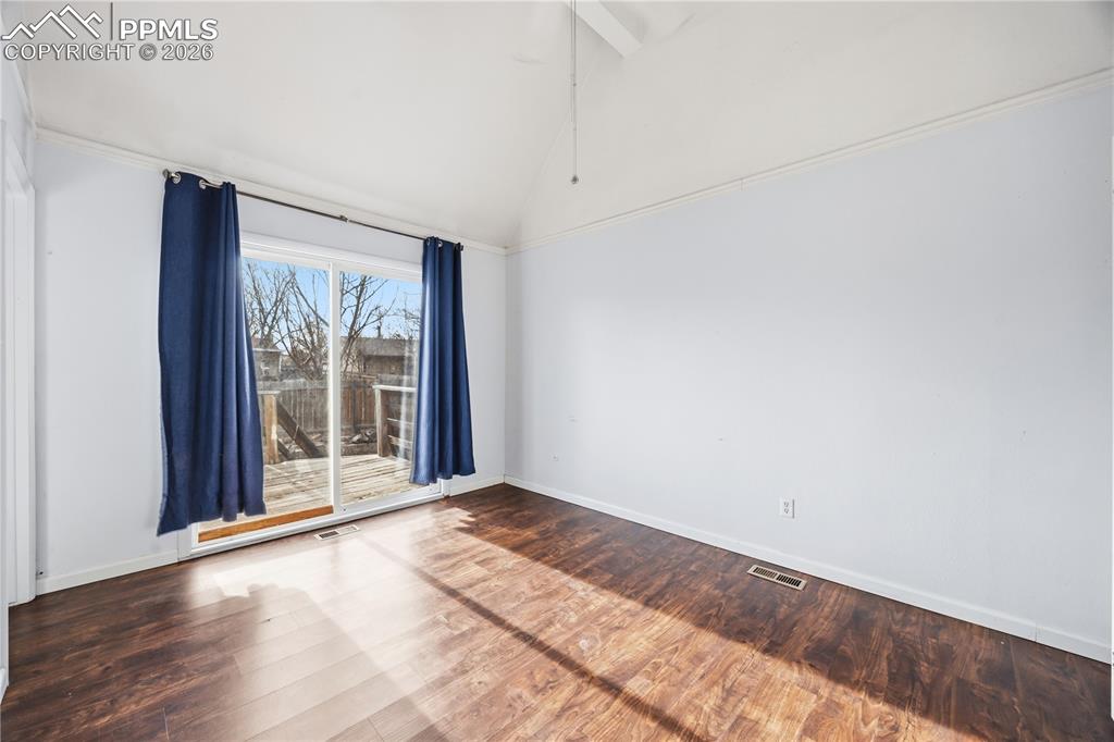 The upper level Primary Bedroom is a private retreat with a slider to a backyard deck with stairs to the backyard.