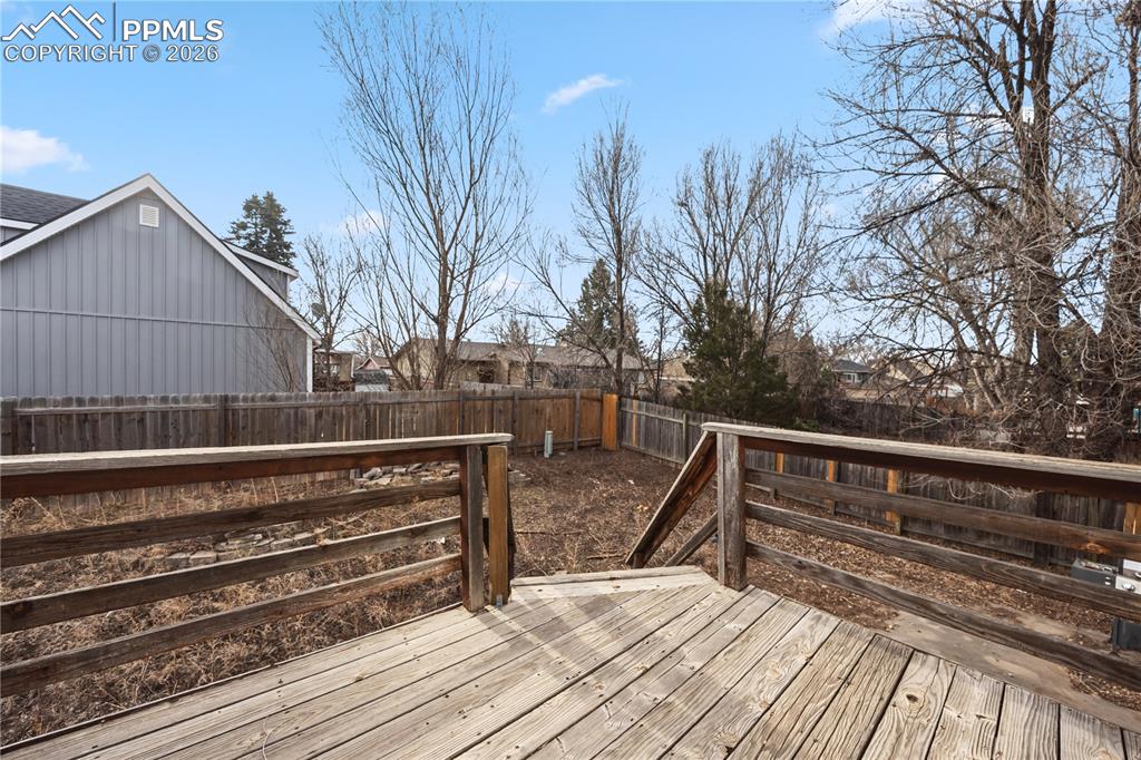 Backyard deck with stairs to the backyard. 