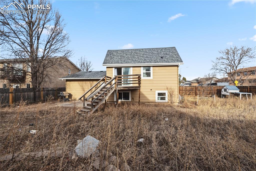 The fenced backyard has a concrete patio, deck with stairs to the backyard, a storage shed for tools and toys, and room for RV or small boat parking.