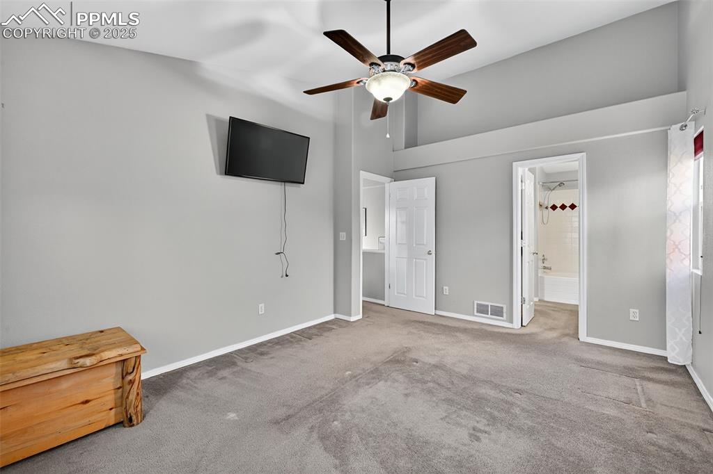 Primary Bedroom with Ceiling fan and attached bath on Main floor. 