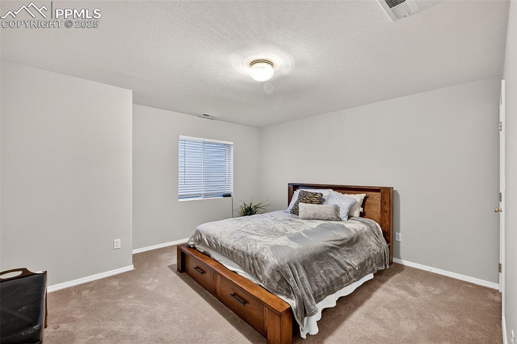 Bedroom #3 in finished basement has large closet. 