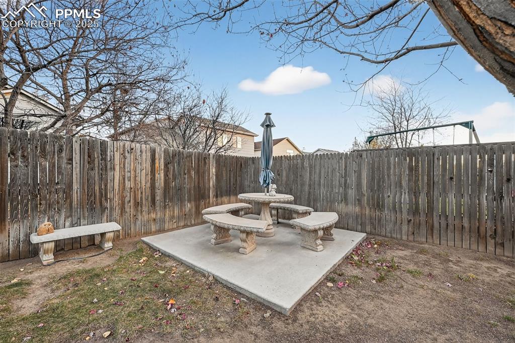 Spectacular patio in corner of back yard. This stunning concrete patio set can be included!!!