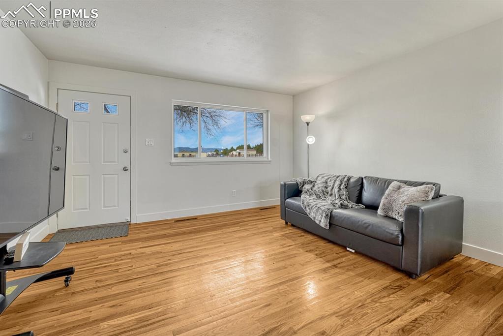 Second entrance and living room on south side of the home. Mountain views!