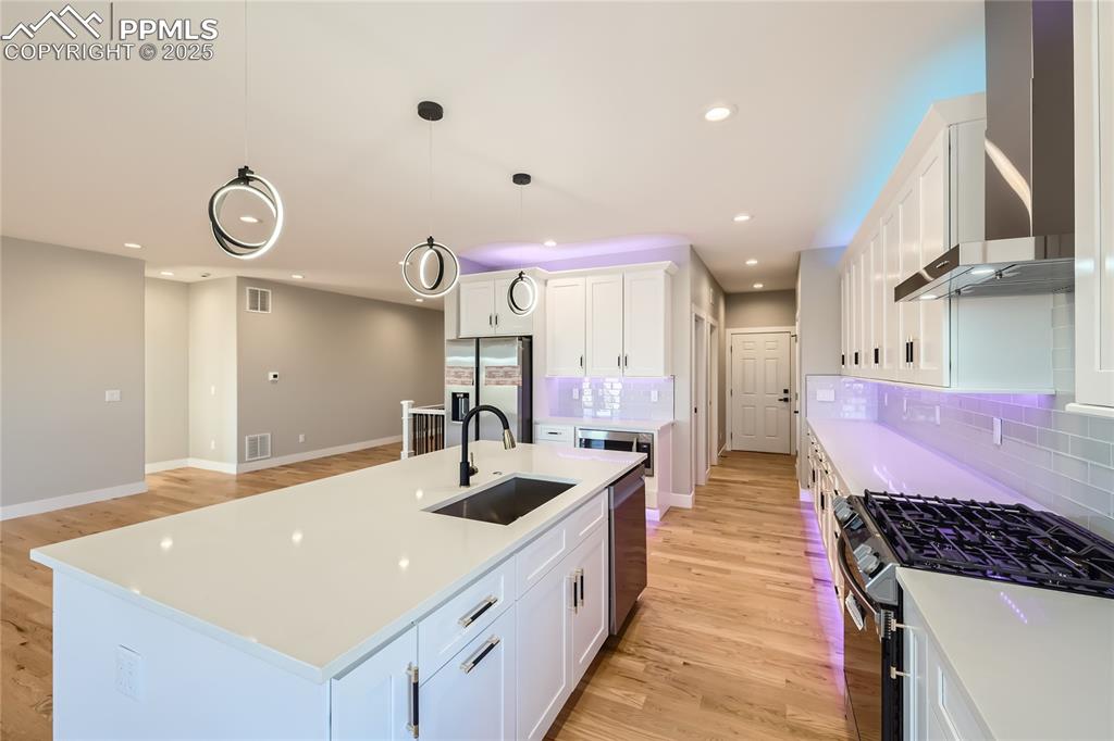 Just off the kitchen, you'll find a roomy pantry, coat closet, laundry room and access to the 3-car garage. There's a covered side patio, too!