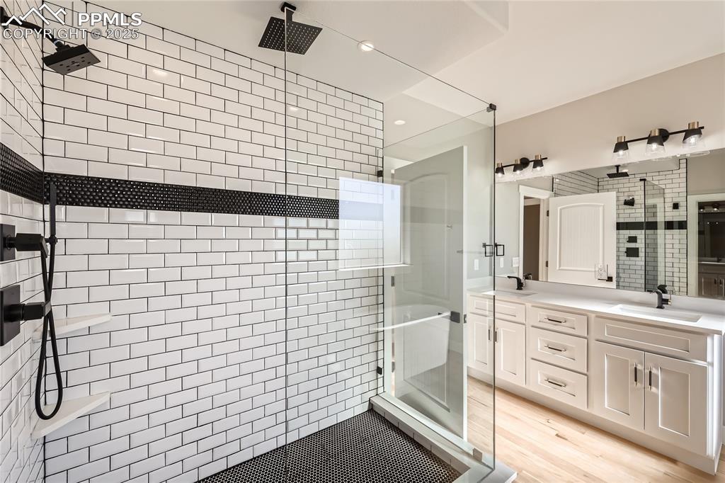 Check out the amazing, custom-designed shower. This bathroom offers an electric fireplace, too! In addition, it has a separate toilet room, and a massive walk-in closet!
