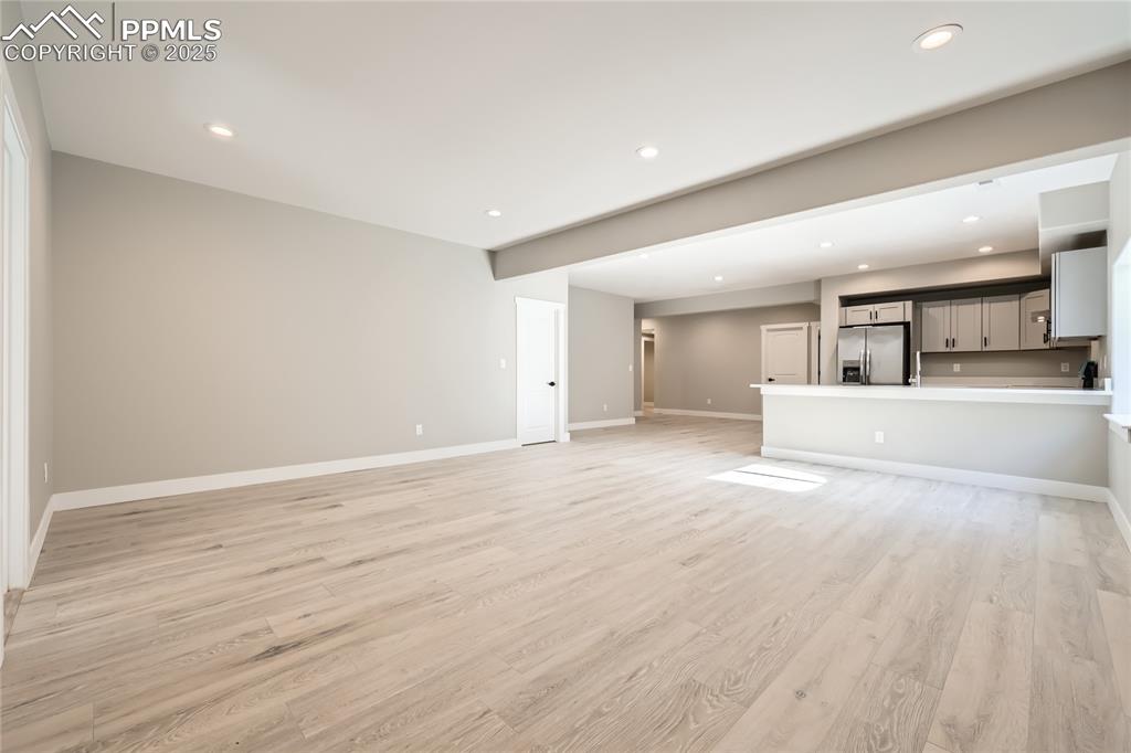 And WOW - what a family room! This lower level offers a HUGE family room, dining area, full kitchen, 4 bedrooms, 2 bathrooms, and a laundry room! Thinking about in-laws living here, or rental possibilities? The possibilities are endless!