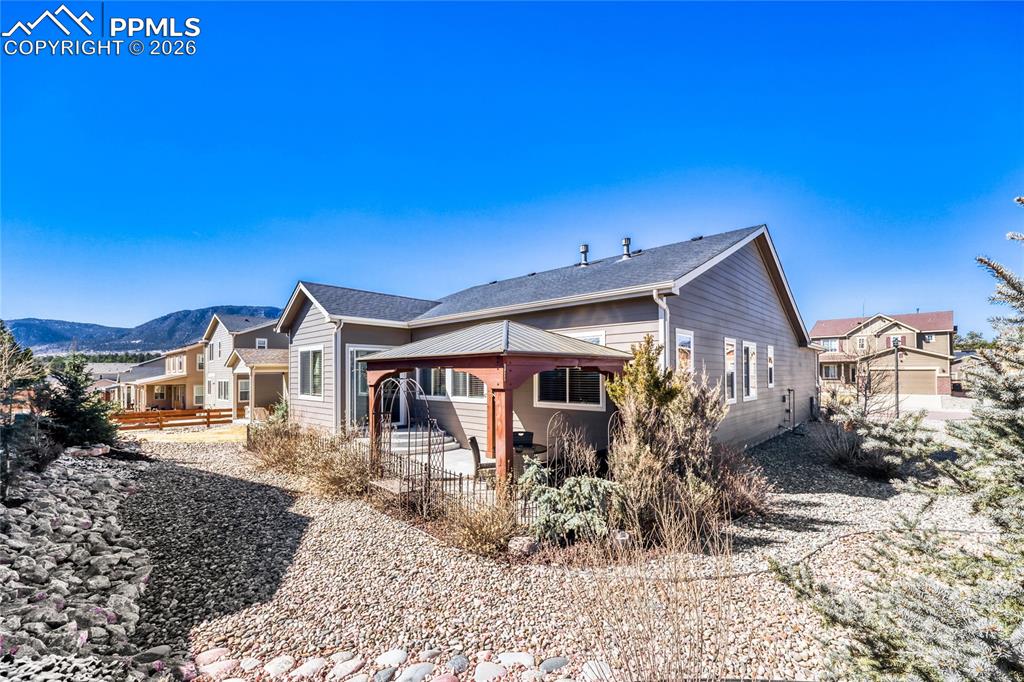 Rear view of property featuring a patio area