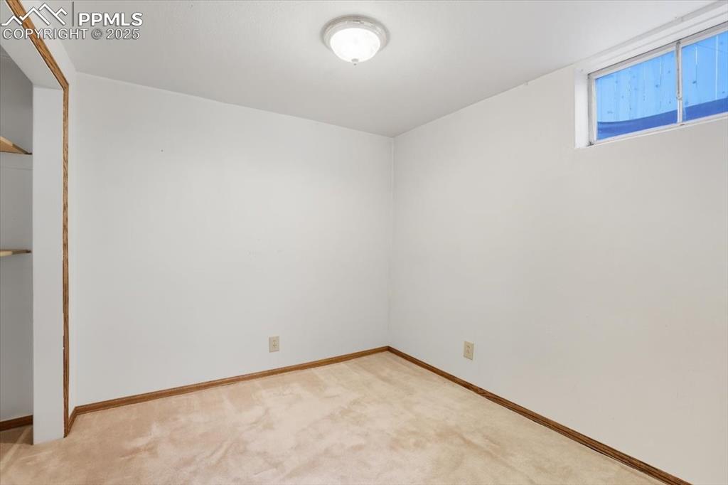 Unfurnished bedroom with a closet and light colored carpet