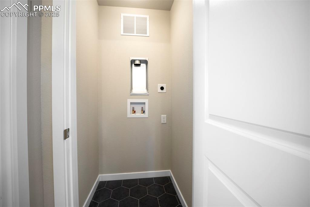 Upper level multi-gen suite stackable laundry