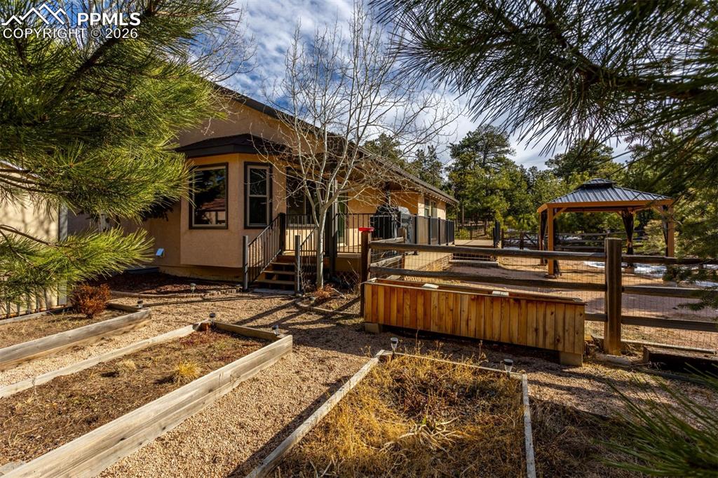 Raised garden beds, gazebo stays