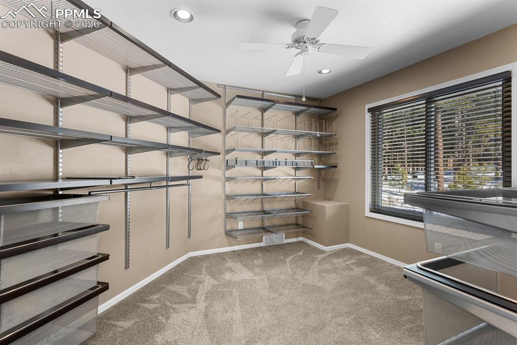 Primary bedroom walk-in closet.  1 of 2 closets