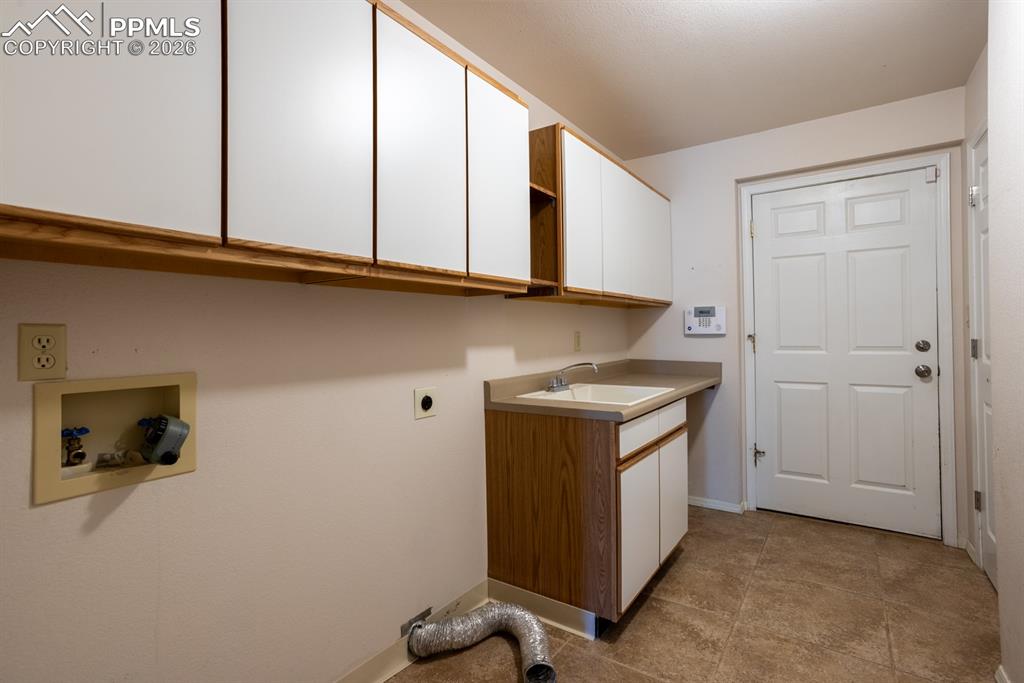 Main level laundry with door to garage