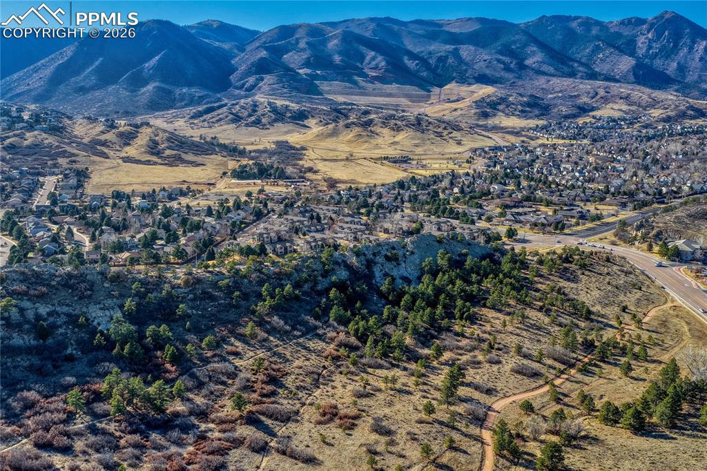 Ute Valley Open Space with Arbors at Mountain Shadows behind, and the Front Range in the background.