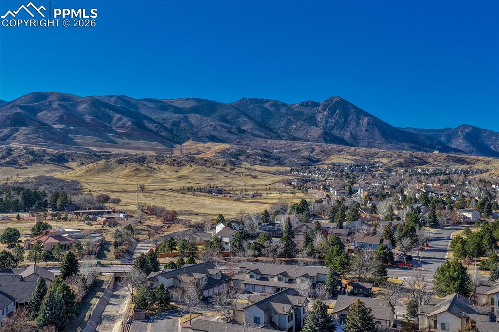 The Arbors at Mountain Shadows with the Rockies on the background.